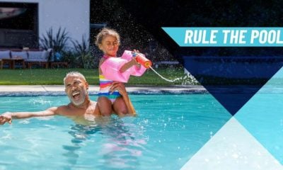 Man and little girl playing in a swimming pool. Rule The Pool in text