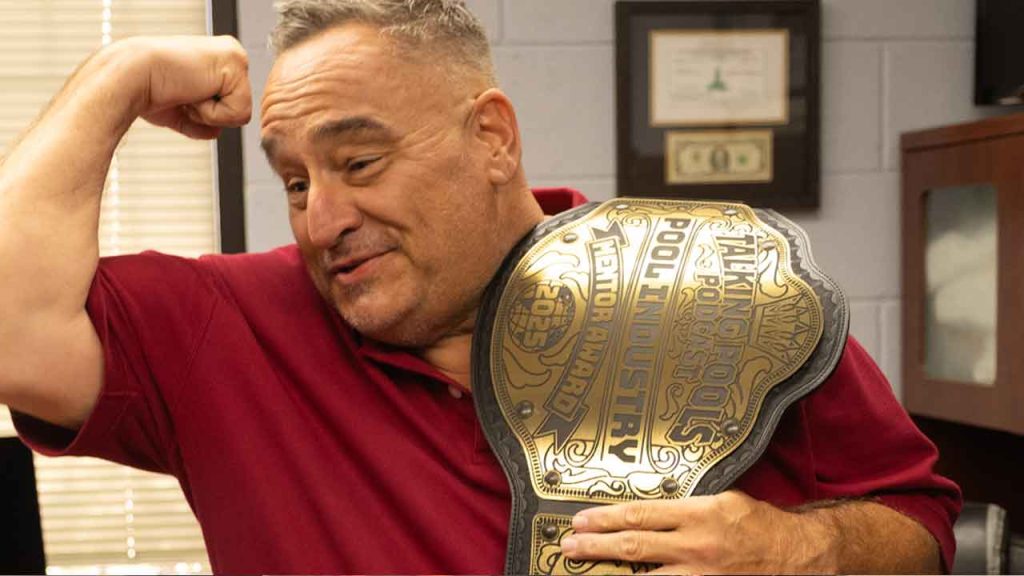 Rich Gallo posing with the Talking Pools Podcast - Mentor of the Year Award Belt